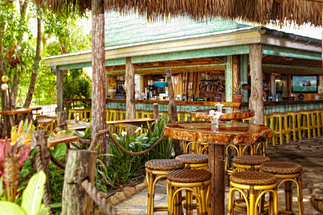 tiki hut bar at outdoor tropical themed bar