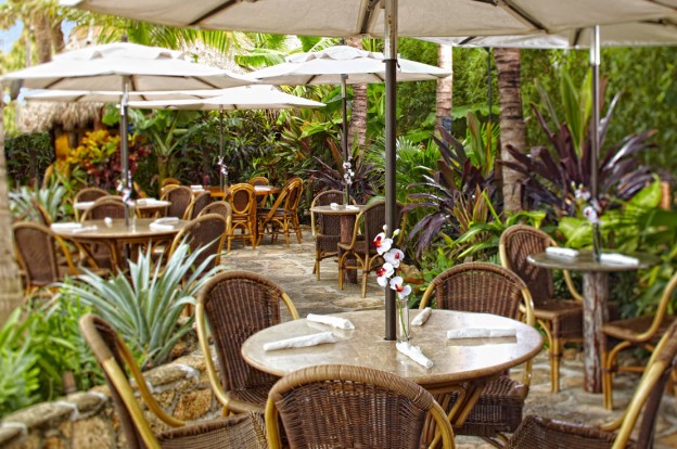 dining tables at outdoor tropical themed restaurant